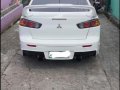 Pearl White Mitsubishi Lancer 2010 for sale in Quezon City-0