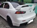 Pearl White Mitsubishi Lancer 2010 for sale in Quezon City-7