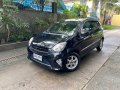 Selling Black Toyota Wigo 2015 in Quezon-5