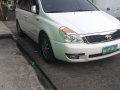 Selling White Kia Carnival 2011 in San Pedro-1