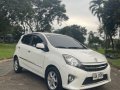 Pearl White Toyota Wigo 2014 for sale in Quezon City-2