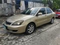 Selling Golden Mitsubishi Lancer 2010 in Imus-0