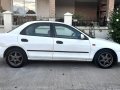 Selling White Mazda 323 1997 in Noveleta-7