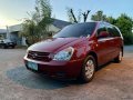 Red Kia Carnival 2.5 (A) 2009-7