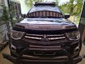 Selling Black Mitsubishi Strada 2014 in Gapan-6