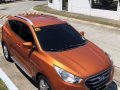 Selling Orange Hyundai Tucson 2013 in Biñan-1