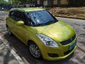 Yellow Suzuki Swift 2012 for sale in Pateros -4