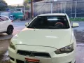 Selling White 2010 Mitsubishi Lancer Ex -0
