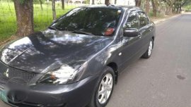 2012 Mitsubishi Lancer GLX and 2005 Nissan Patrol Presidential Edition