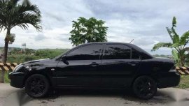 2012 mitsubishi lancer GLX (pyrenese black color)