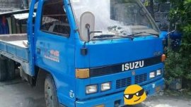 For sale..izuzu Dropside 200k double tire 14ft long..