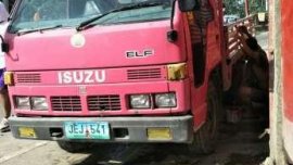 Fresh Isuzu Elf 2010 Red MT For Sale