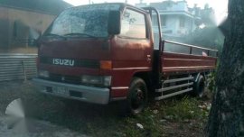 Isuzu Elf Dropside 1999 Red MT For Sale