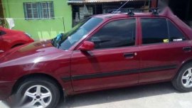 Mazda 323 97 model in good condition for sale