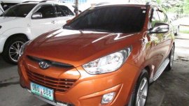 2013 Hyundai Tucson orange SUV gasoline for sale 