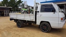 2015 L300 FB dropside flatbed with aircon seven thousand kms only