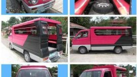 Passenger type suzuki multicab pink and blue and Nissan Urvan estate