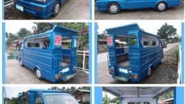 Multicab Suzuki passenger type blue and Pink and Nissan urvan Estate