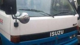 isuzu elf dropside and boomtruck