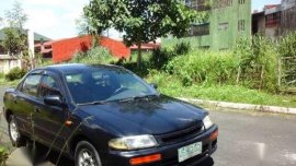 Mazda 323 Glxi Rayvan 1997 MT Black For Sale