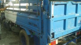 Isuzu elf NKR dropside with lifter for sale 