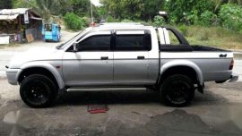 Strada Mitsubishi  truck silver for sale 