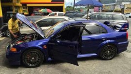Mitsubishi Evolution sedan blue for sale 