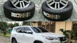 Toyota 4runner oem wheels 20x8. Nitto terra 265 50 20 tires.