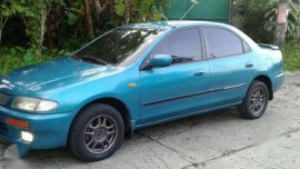 Mazda 323 familia glxi rayban