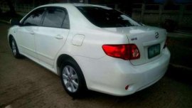 Toyota Corolla Altis E white glossy paint 2008model