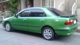 Selling my Mazda 323 Familia 97 Mdl for sale 