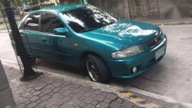 Mazda 323 Familia 1997 MT Green For Sale 