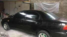 Mazda Familia 323 1997 AT Black For Sale 