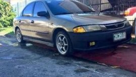 99 Mazda 323 rayban GOOD AS NEW FOR SALE