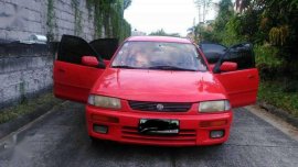 Mazda 323 Familia 1996 red for sale