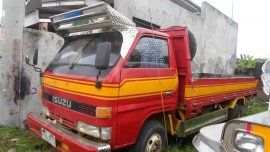 Isuzu Elf 4BC1 14ft Dropside Red Truck For Sale 