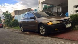 Mazda 323 Rayban Gen 2.5 MT Brown For Sale 