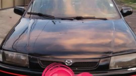 98 mdl Mazda Familia rayban for sale 