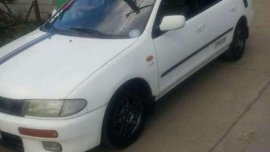Mazda 323 Familia AT White Sedan For Sale 
