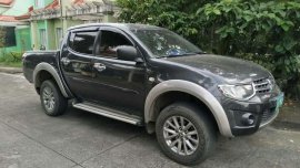 For sale 2012 Mitsubishi Strada 4x4 automatic.