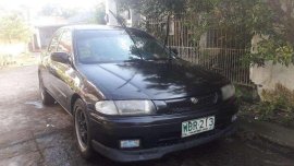 Selling Mazda 323 Familia Gen 2.5 1998