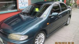 Rush Sale Mazda 323 sedan quality 2nd hand 1999