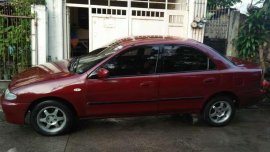 Selling lady driveN Mazda Familia 323 1996 