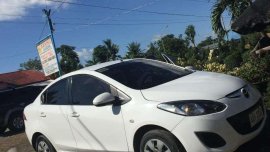 Mazda 2 Sedan white (slightly used) 2014 model
