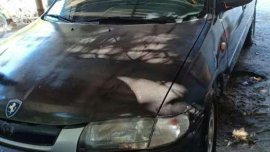 Like new Mazda 323 sedan for sale