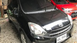 Selling Black Toyota Wigo 2014 in Quezon City
