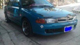 Selling Blue Mitsubishi Lancer 1995 at 161219 km in Quezon City