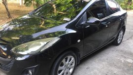 Black Mazda 2 2010 Sedan at 134000 km for sale