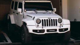 White Jeep Wrangler 2016 at 27000 km for sale