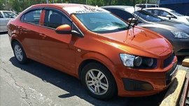 Orange Chevrolet Sonic 2015 at 30303 km for sale 